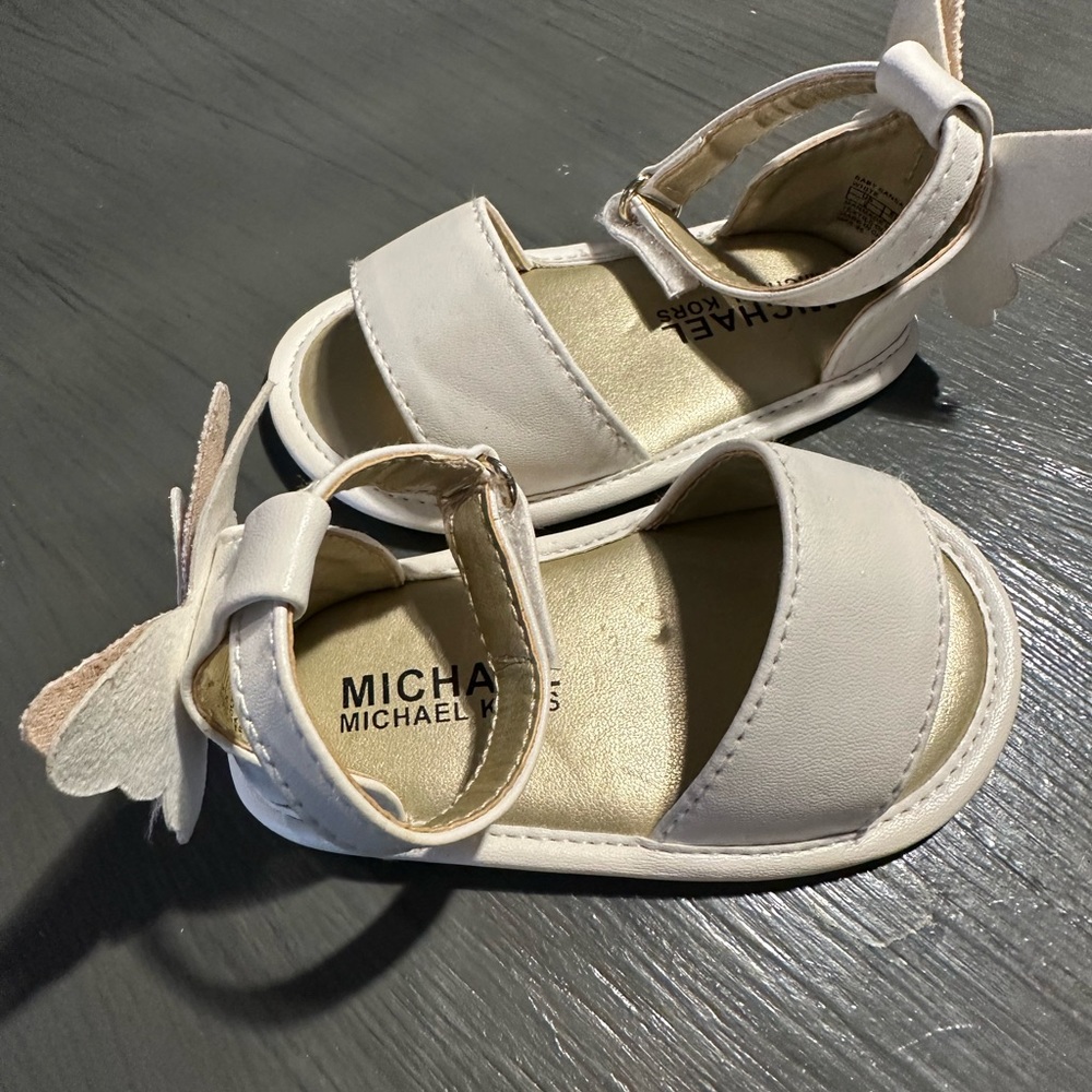 Size 3 Michael Kors Sandels never worn relish.like new never worn gold butterfly